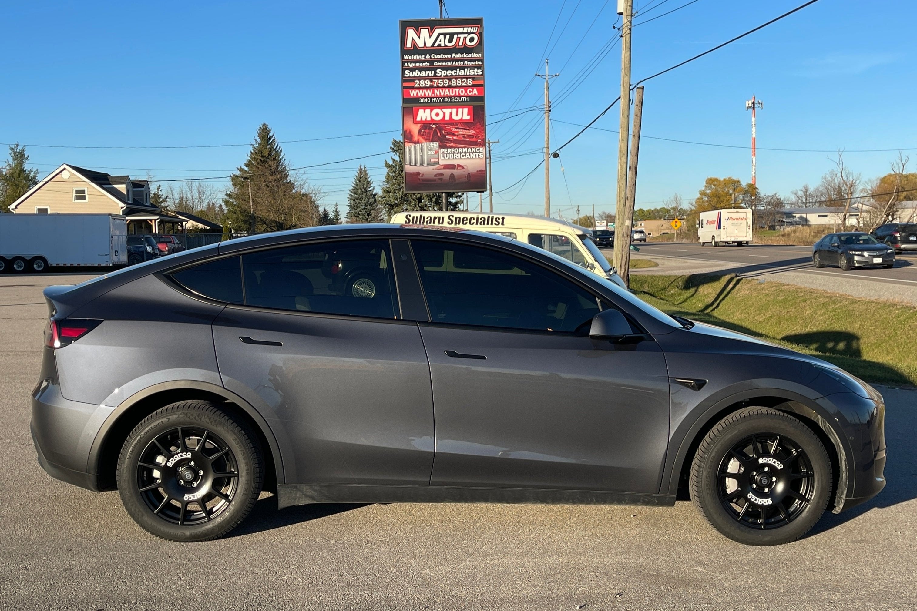 NV Auto Signage with a Tesla Model Y on Winter Tires and Wheels